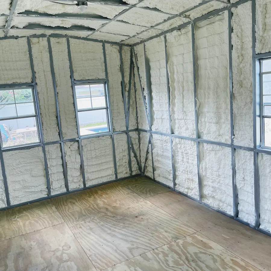 Closed-cell spray foam insulation applied to wall cavities in a residential project in Three Oaks